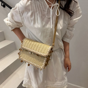 Chic woven straw shoulder bag with light brown PU straps for summer beach vacations