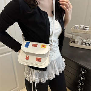 White minimalist square crossbody bag with colorful cartoon patches for women's summer fashion