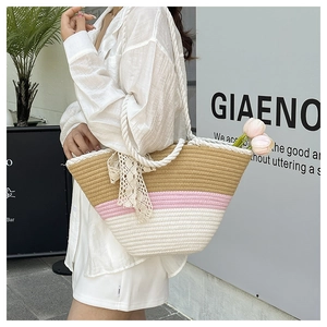Detailed side view of tri-color woven tote bag with lace bow and sturdy rope handles