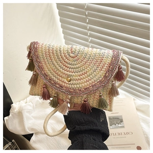 Bohemian woven straw shoulder bag with colorful fringe tassels and gold clasp