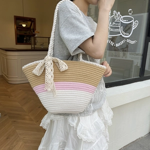 Chic tricolor woven bucket bag with lace bow detail for casual summer vacation style