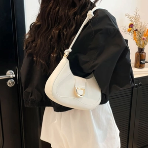 French style white hobo underarm bag with gold D-ring buckle and knotted leather strap