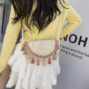 Bohemian woven crossbody bag with colorful embroidery and multi-colored fringe tassels