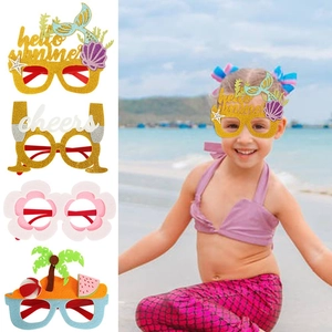 Close-up of kids summer party glasses with Hello Summer mermaid and flamingo themes