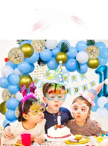 Children at a birthday party wearing tropical flower and palm tree novelty party glasses