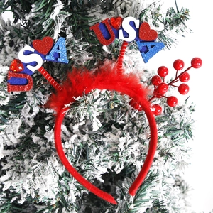 Detail of USA themed headband with red feathers and glittering heart on spring