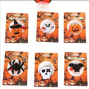 Detail view of 6 Halloween brooches with felt and sequins on festive display cards