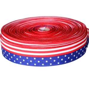 Detail of burlap ribbon roll with American flag stars and stripes pattern for party decor