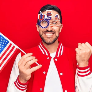 Patriotic USA themed party glasses for 4th of July celebration worn by a male model
