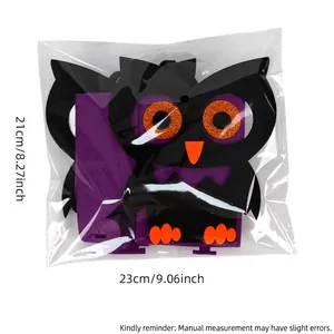 Halloween felt owl candy bag with purple accents and size markers for party decoration
