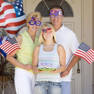 Three-piece USA Independence Day party glasses set worn by models in festive setting