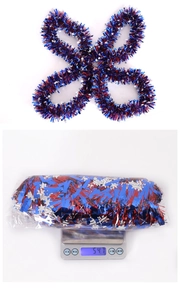 Detail of red white and blue July 4th tinsel garland with stars and package weight 54.7g