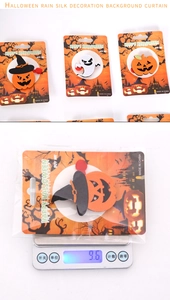 Detailed weight measurement showing 9.6g for Halloween pumpkin and ghost felt brooches