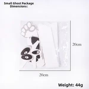 Detailed view of a white Halloween ghost tissue paper honeycomb hanging in poly bag