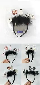 Detail of Halloween ghost and skull headbands with feathers showing weight of 25.2g on scale