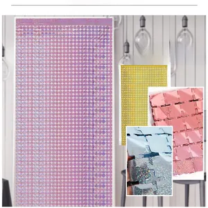 Detail of square laser tinsel foil curtain with plus-shaped cutouts for party decor
