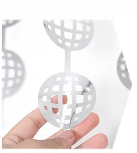 Close-up of a silver disco ball ornament featuring a hollow mesh design for party decoration