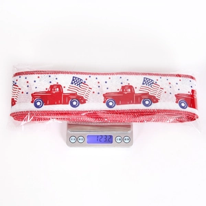Weight measurement of Independence Day ribbon showing vintage truck and flag patterns