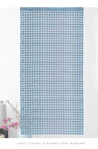 Detail of light blue laser iridescent square curtain with shimmering metallic grid texture