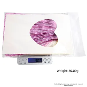 Pink foil fringe curtain for party decor weighing 30g in transparent packaging