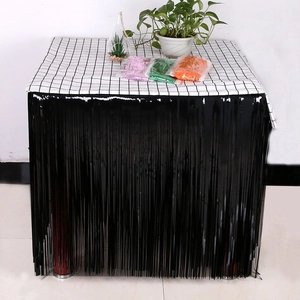 Detail view of black tinsel table fringe for party decoration with packaged samples