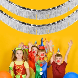 Silver fringe curtain backdrop for birthday party decoration with metallic tinsel streamers