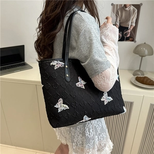 Fashionable black quilted tote bag with colorful butterfly embroidery and large capacity