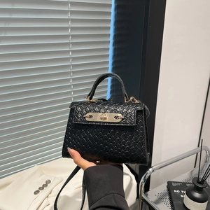 Classic black woven texture trapezoid handbag with gold lock and top handle for women