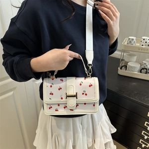 Cute cherry print crossbody bag with wide strap and gold metal clasp for women