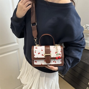Retro white crossbody bag with cherry prints and brown leather trim for women