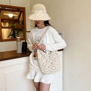 Minimalist beige crochet tote bag with openwork diamond weave and wide shoulder strap