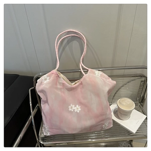 Detail of pink marble pattern tote bag featuring delicate white 3D flower embroidery