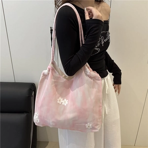Pink tie-dye tote bag with floral appliques and beaded accents for summer style
