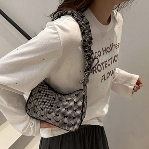 Chic black and white gingham quilted pillow bag with bow accents and scrunchie strap
