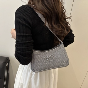 Silver glitter baguette shoulder bag for women with metallic bow detail in a stylish look