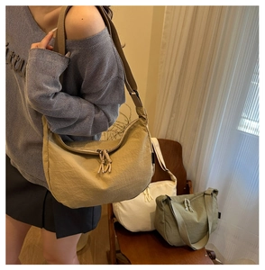 Three minimalist candy-colored crossbody bags in khaki, beige, and olive green colors