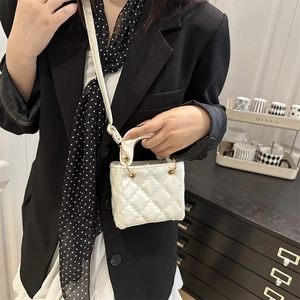 White quilted crossbody bag with gold ring handle and chain strap for women fashion