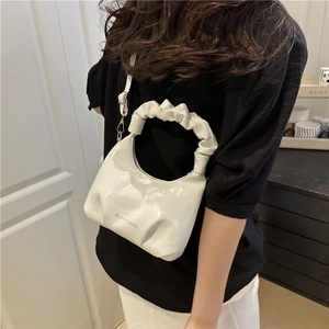 White ruched cloud bucket bag with scrunchie handle and adjustable shoulder strap