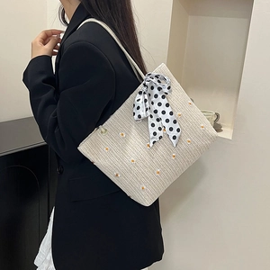 Borsa tote in paglia beige minimalista con ricamo a margherita e fiocco a pois