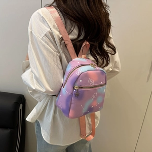 Mini backpack for women featuring rainbow tie-dye pattern and heart shaped love print