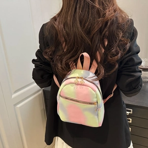 Mini backpack for women featuring macaron tie-dye patterns and gold flower zipper charms