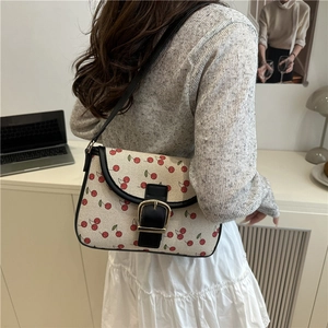 Chic cream canvas handbag with red cherry print and black leather trim for women