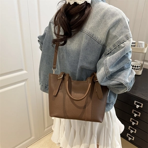 Vintage dark brown pebble leather bucket bag for women with gold hardware and top handles