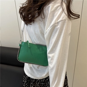 Fashionable neon green crocodile pattern chain crossbody bag with silver rivet details