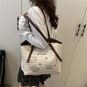 Beige knitted tote bag with cute cat embroidery and brown adjustable shoulder strap