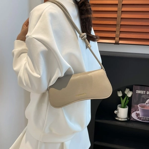 Minimalist beige leather underarm shoulder bag for women with gold logo and knotted strap