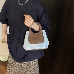 Vintage mini handbag with brown leather and blue tweed patchwork featuring round handle