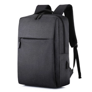 Minimalist dark gray waterproof laptop backpack with USB charging port and padded straps