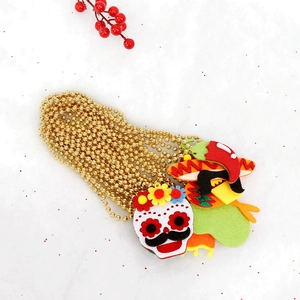 Close-up of Day of the Dead beads with sugar skull and sombrero felt pendants