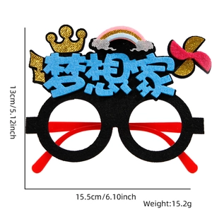 Detail of party glasses with Dreamer text, crown, and rainbow for exams or events
